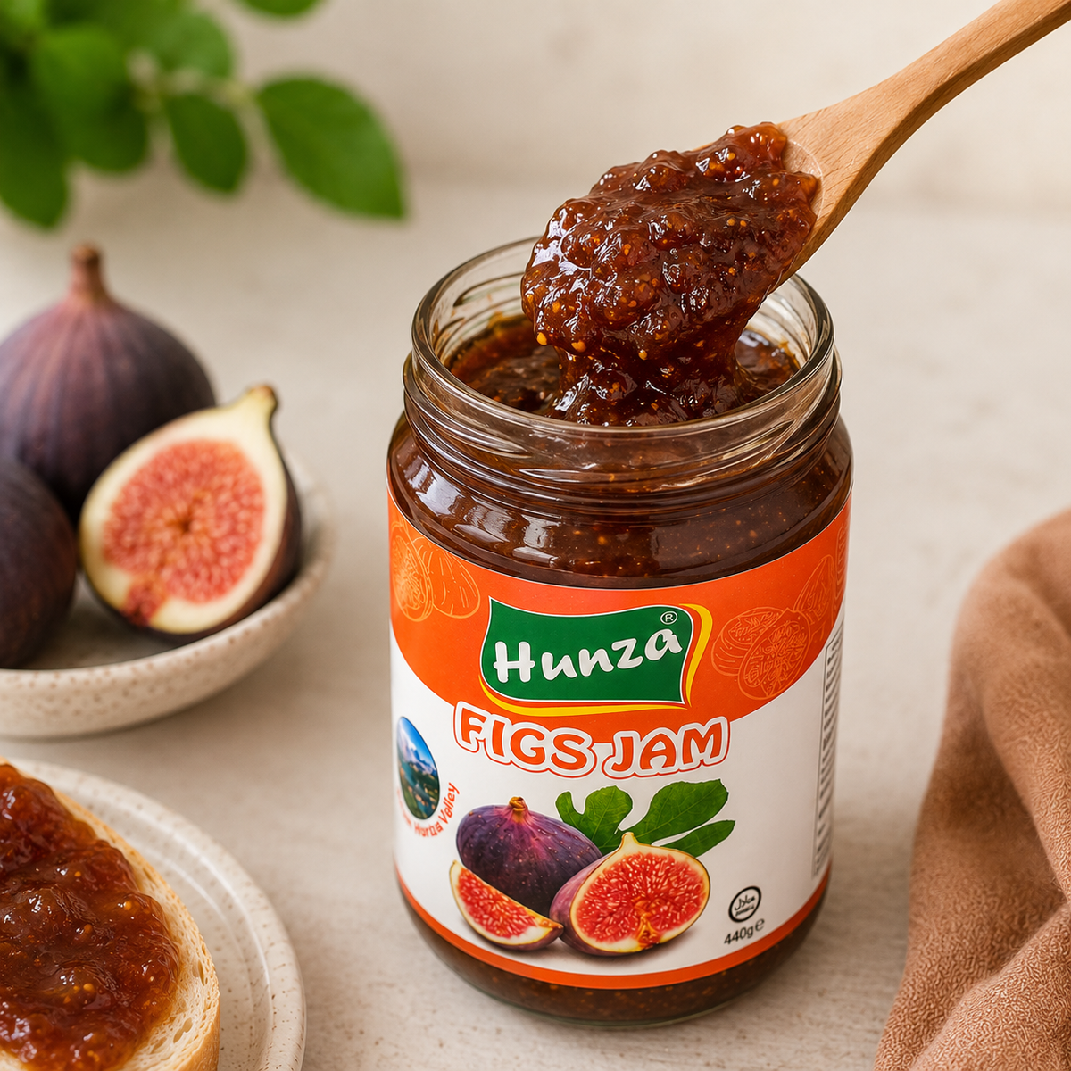 Spoon lifting Hunza figs jam from open 440g jar